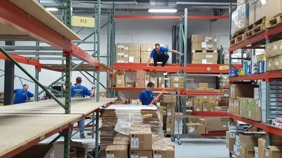Good Guy Movers crew working a warehouse